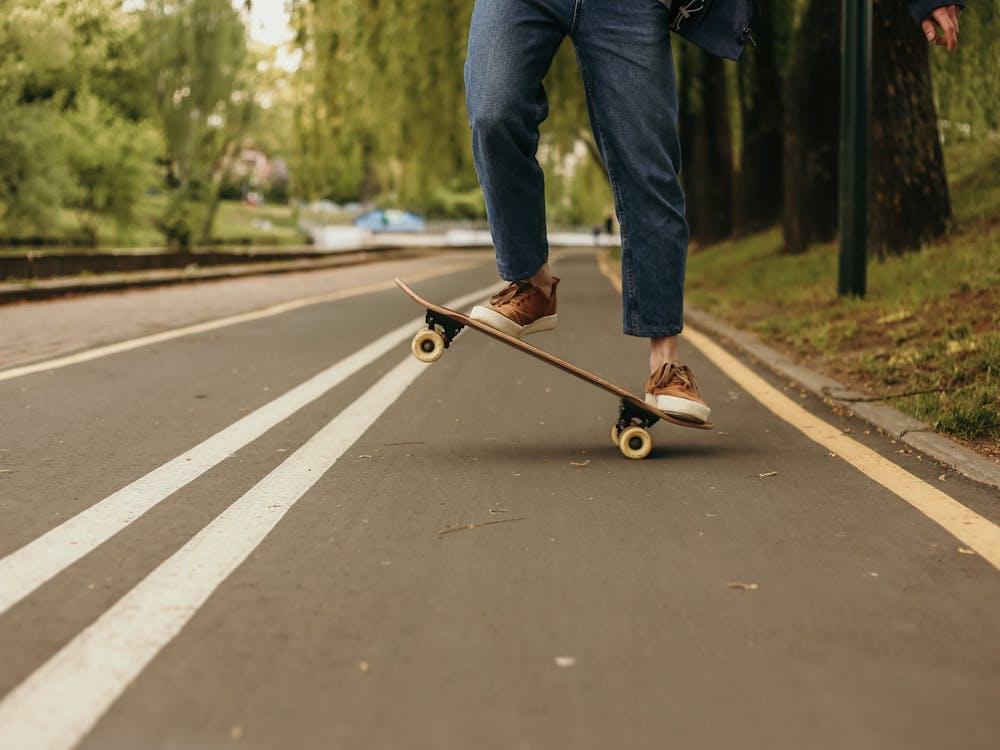 Skateboarder doing trick in park - best electric skateboards